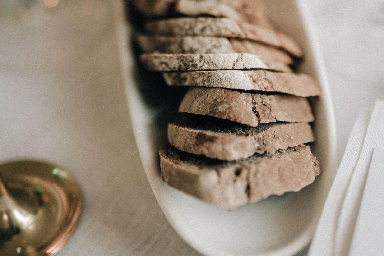 Sliced loaf of soda bread in an elongated bowl