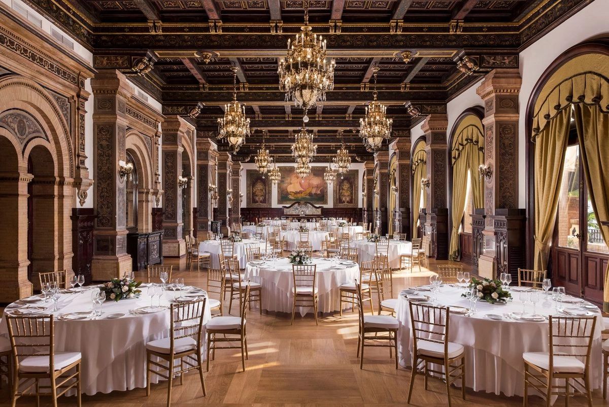 Large royal banquet hall inside a luxurious wedding venue in Spain