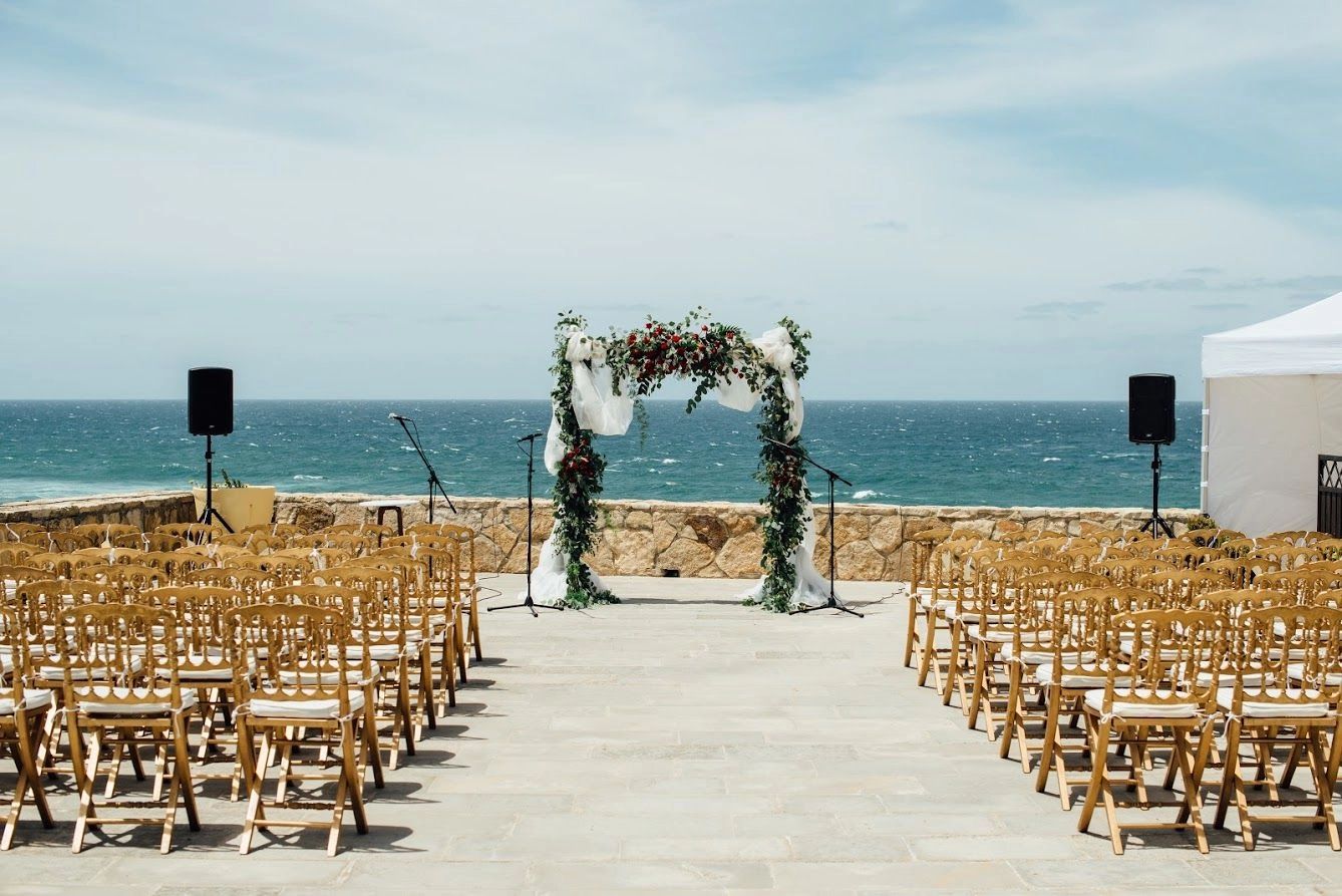 Portuguese outdoor venue arranged for. a wedding ceremony by the sea