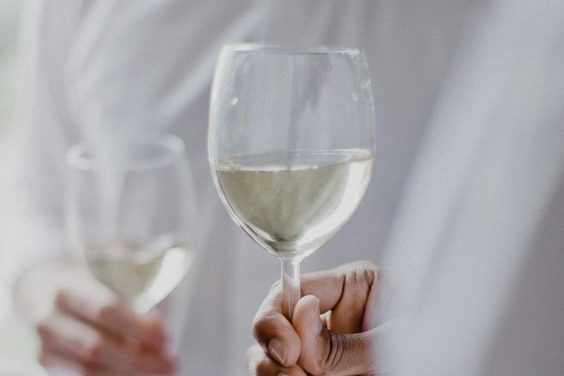 Wine glass with clear liquor inside