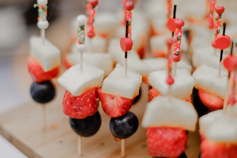 Cheese, strawberry, and grape slices in sticks