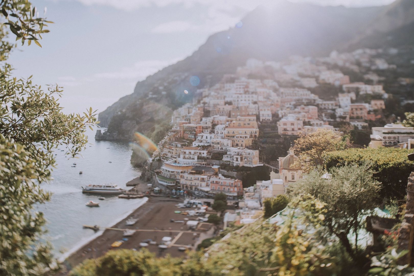 Pastel buildings perched on the hillside of the Amalfi Coast in Italy