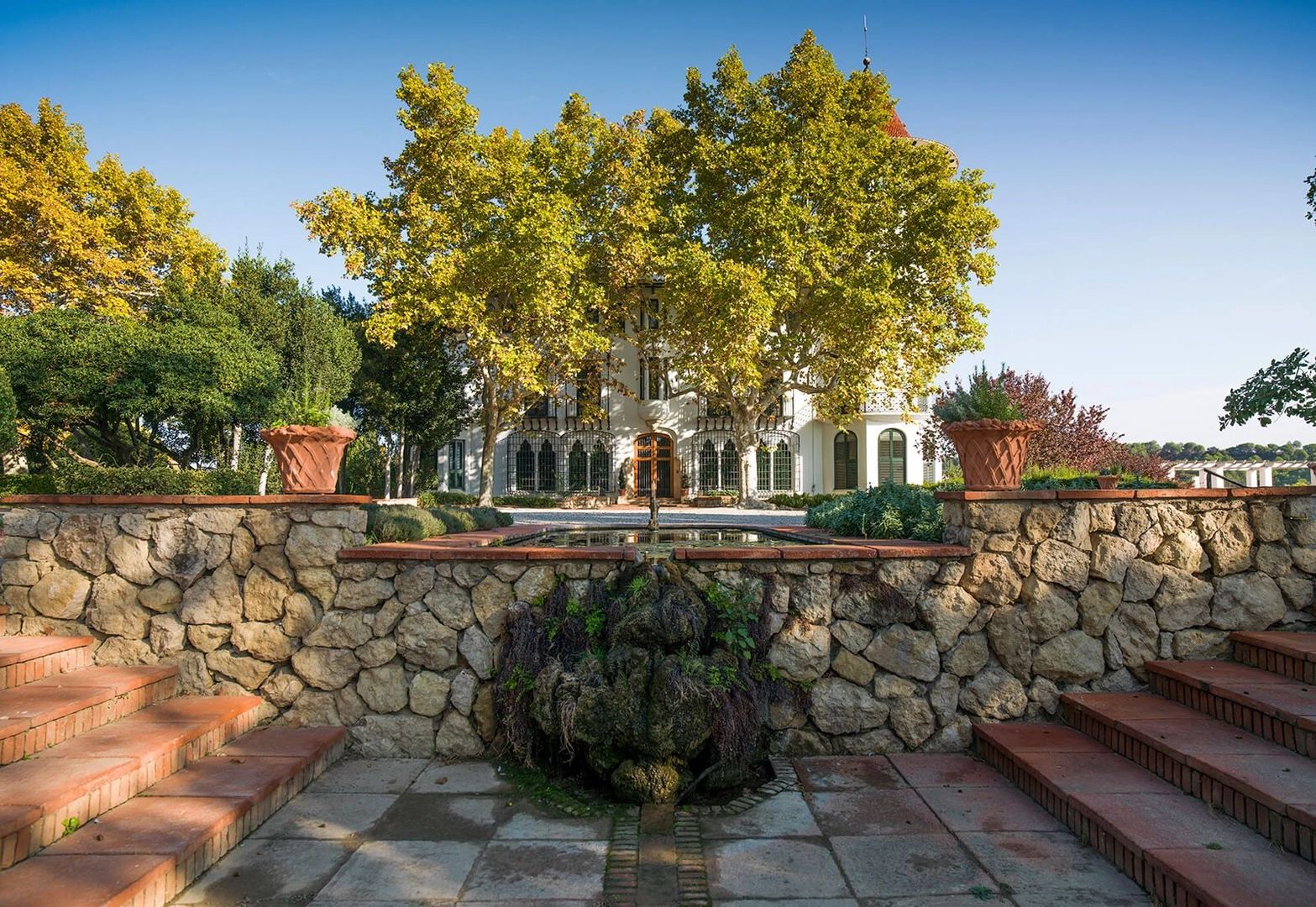 A beautiful white villa in Spain surrounded by trees