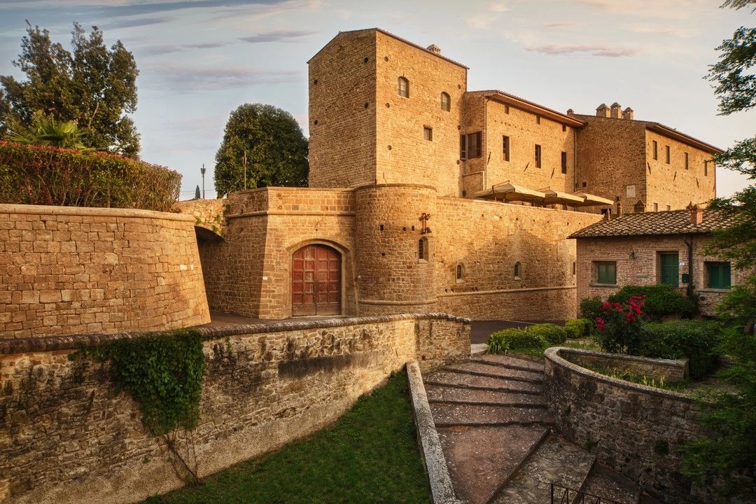 A Renaissance castle in Italy with medieval walls and beautiful greenery