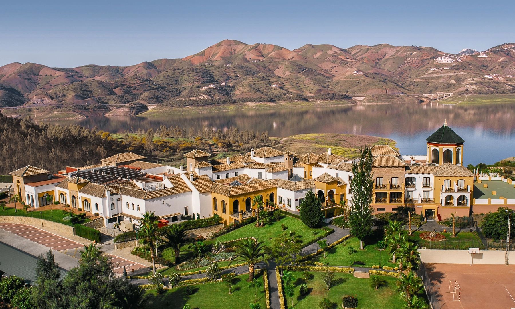 Boutique wedding hotel with a lake and a mountain range in the background