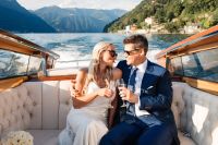 Couple on a boat sailing along Lake Como at an elopement in Italy