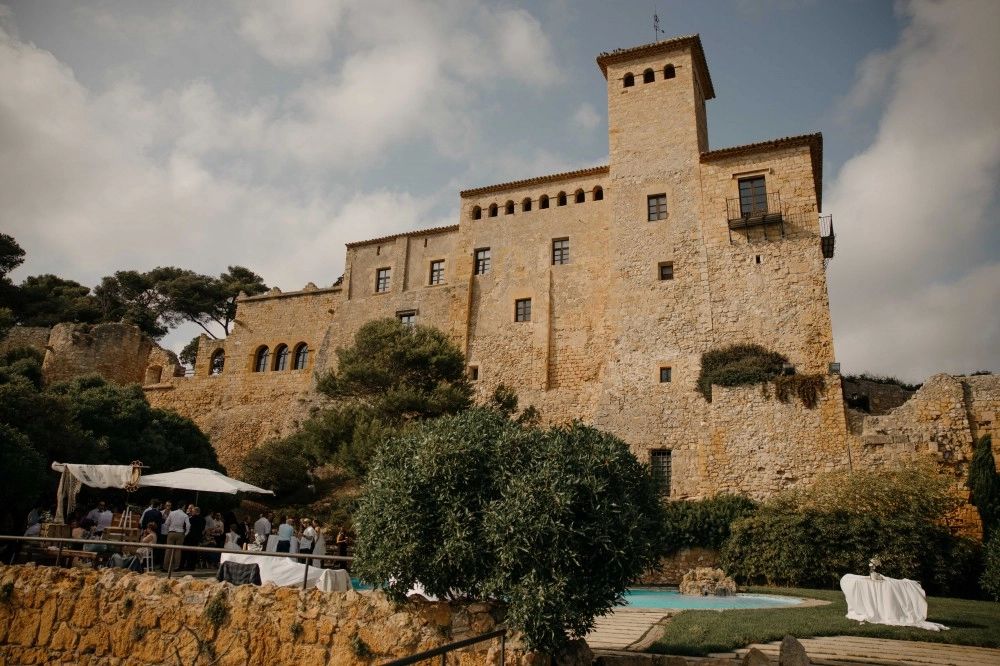 Tall medieval castle for weddings surrounded by trees in the old town of Tarragona