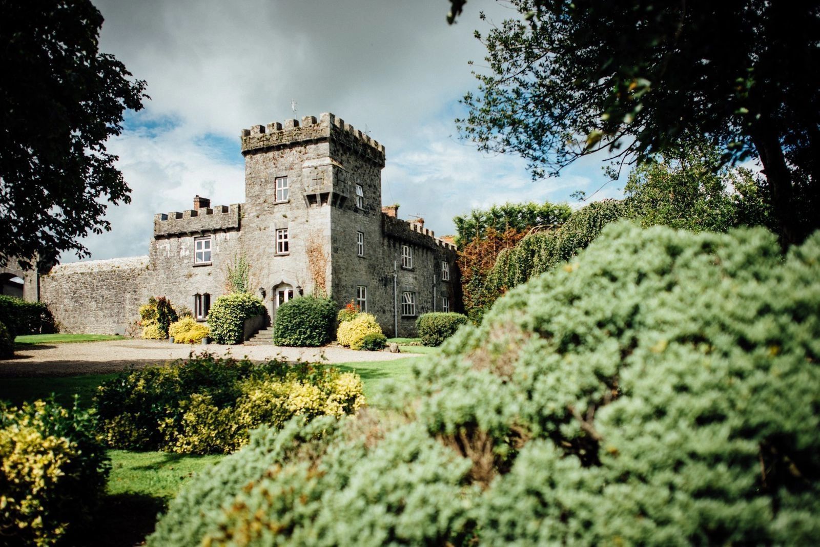 Tower-like castle with lush green outdoors in Ireland