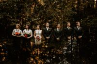 Bride and groom with bridesmaids and groomsmen in a forest at a small wedding in Germany.