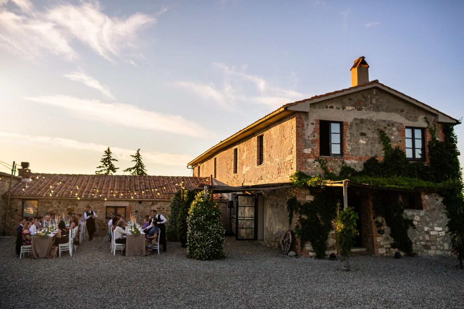 Rustic country house in Siena, Tuscany with a pergola and rolling hills backdrop for Tuscan weddings abroad