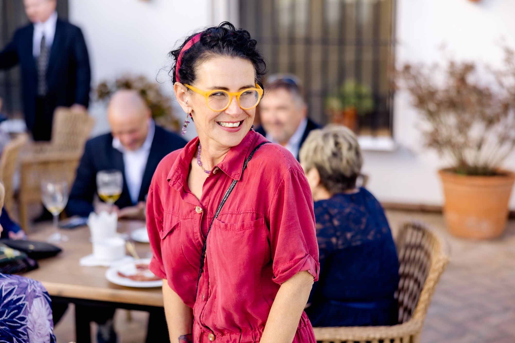 Our wedding planner in Spain in a pink blouse, smiling during a destination wedding in Spain