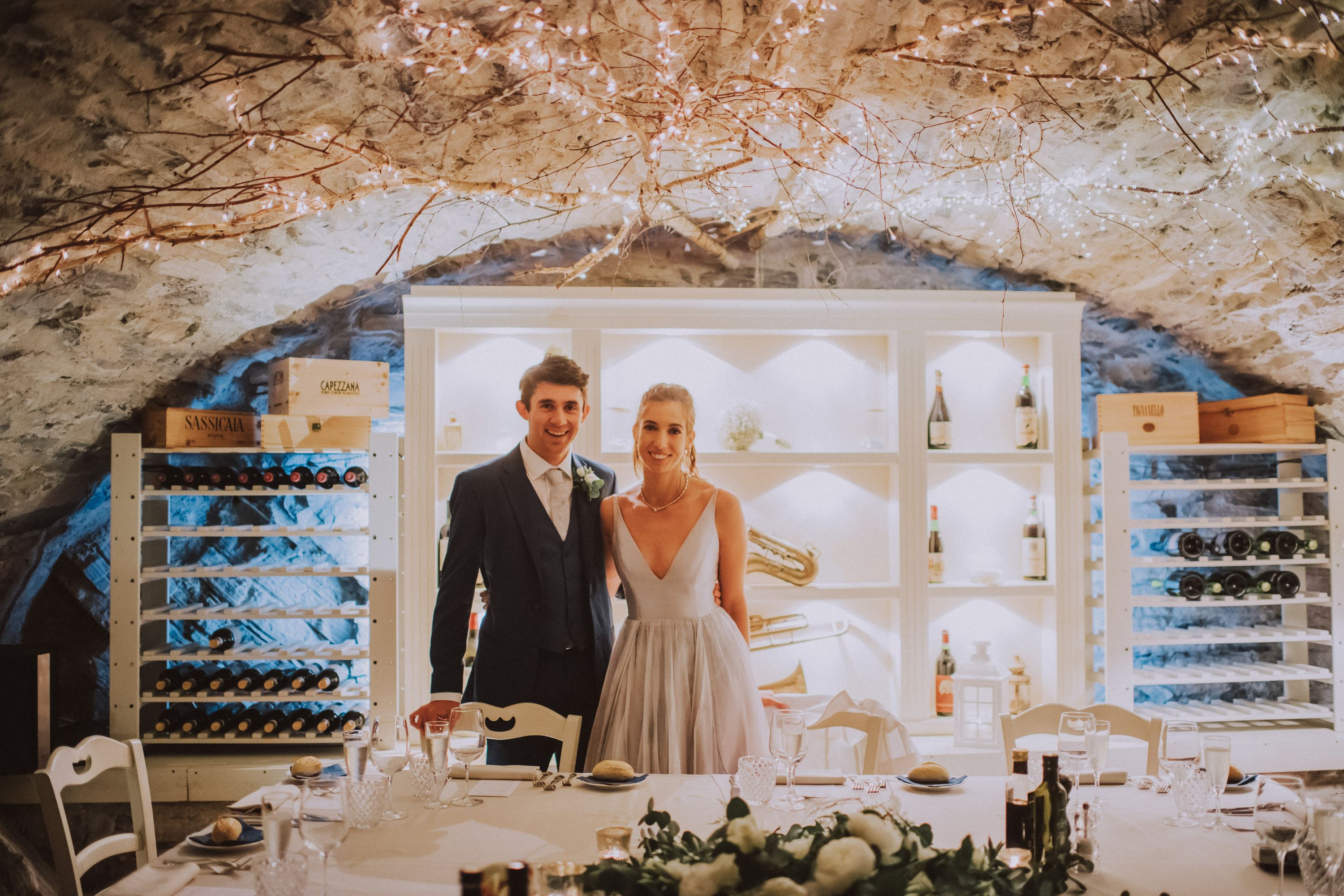 Couple smiling in front of the camera during the reception of their intimate wedding in Italy along Lake Como
