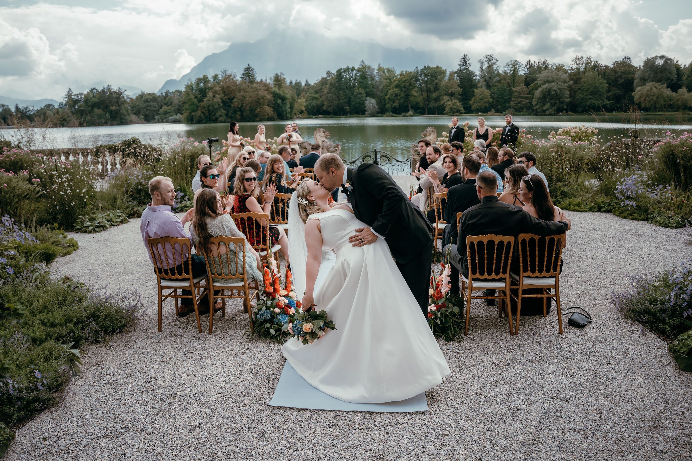 Groom kissing his bride at a destination wedding ceremony in Switzerland