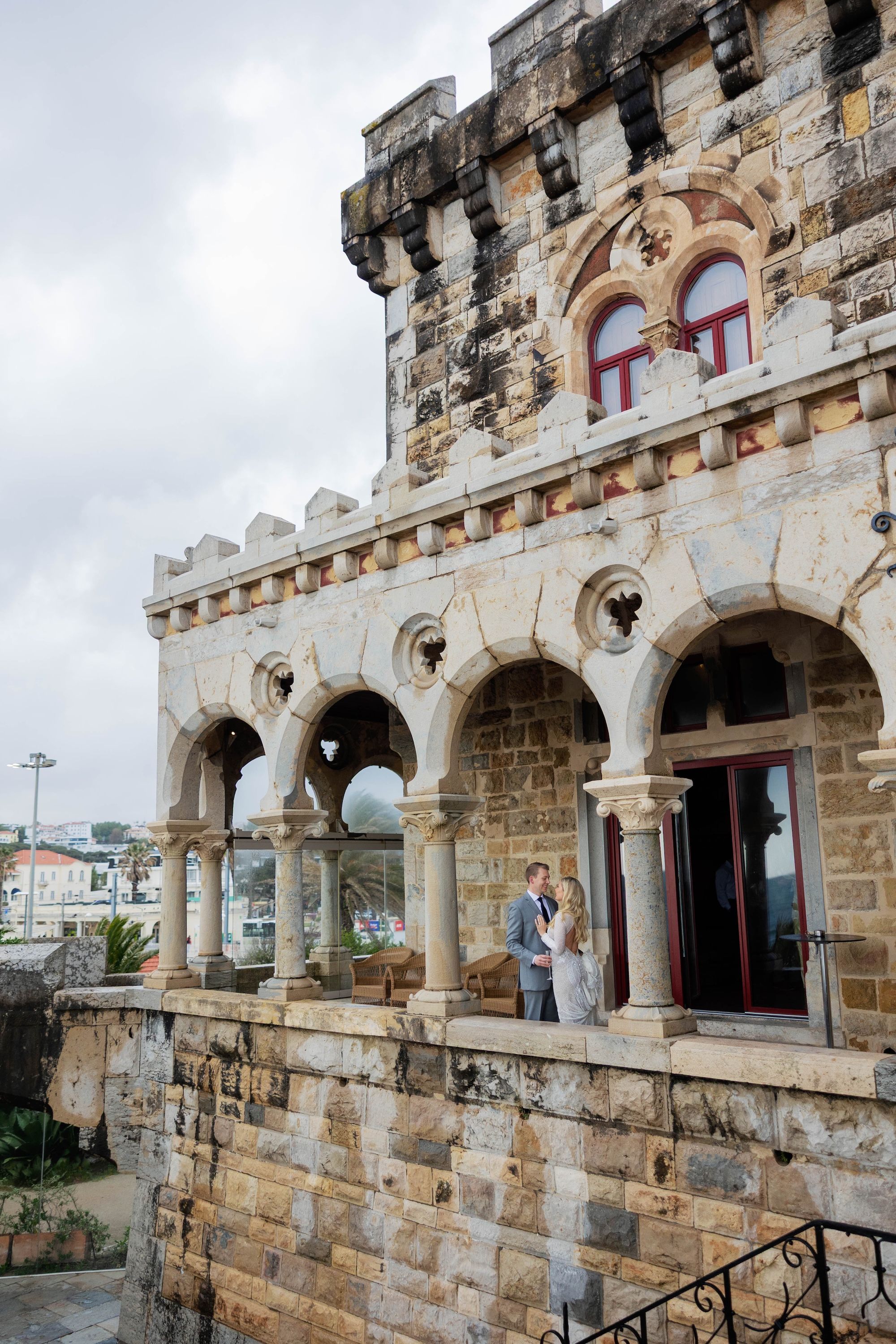 Newlyweds having a photoshoot at a medieval castle during their destination wedding in Portugal
