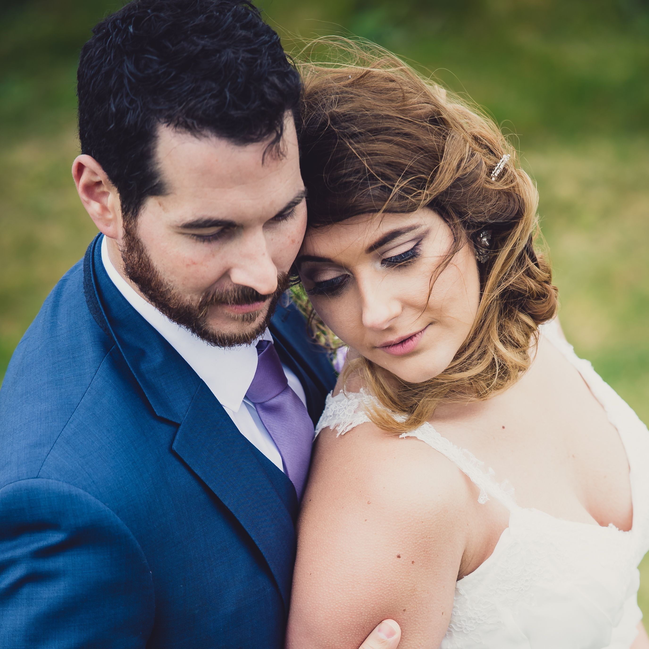Bride leaning backwards to his groom in a dramatic photo of their destination elopement in Ireland