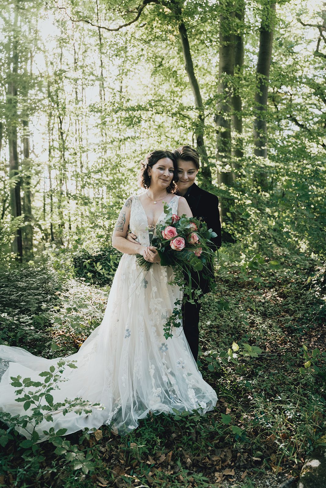 A bride and groom set in a lush forest in Germany for their intimate wedding