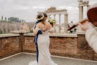 Bride and groom dancing to the tune of a violin during their elopement in Italy
