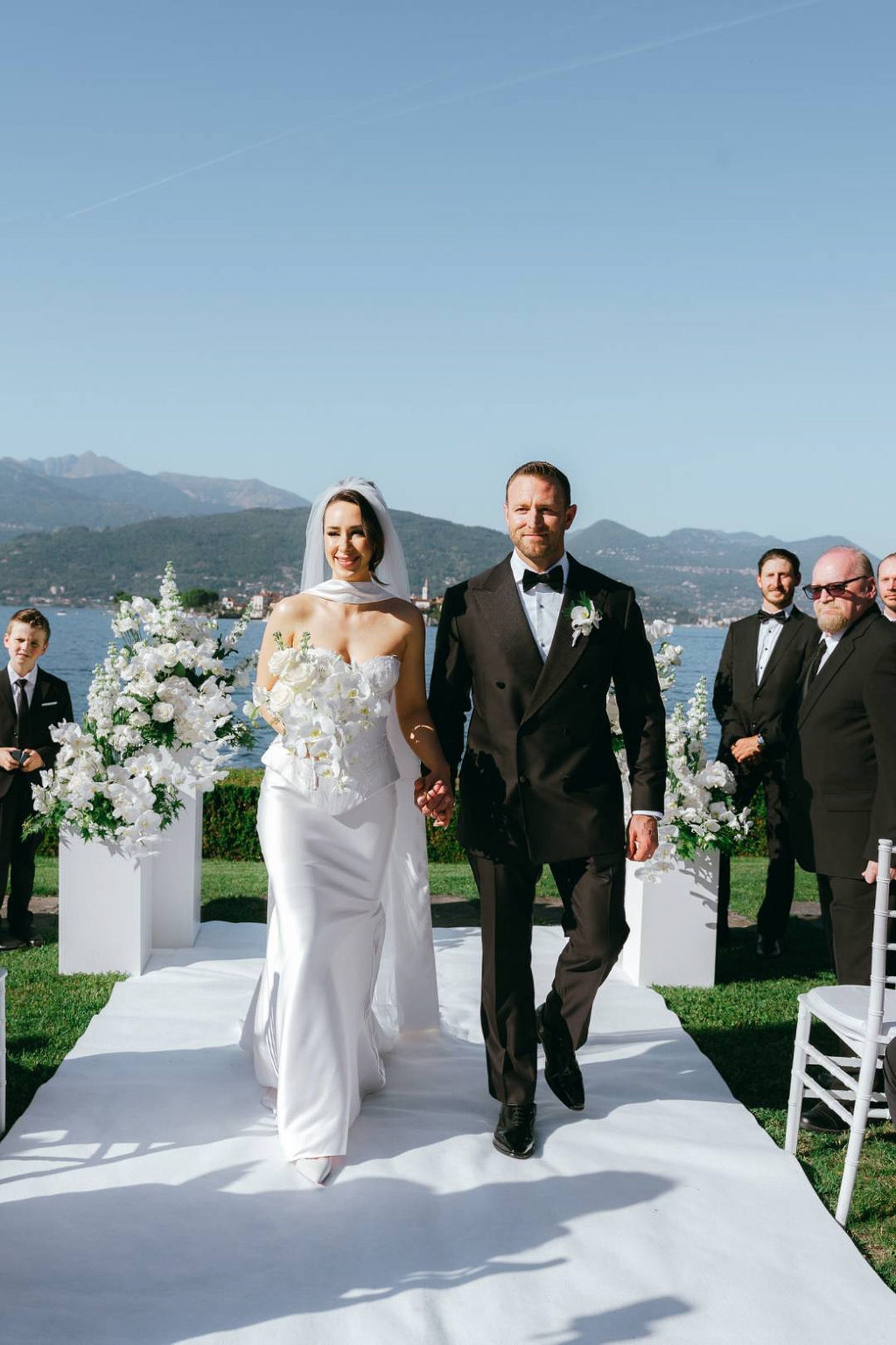 Bride and groom walking down the aisle after their intimate wedding in Italy ceremony