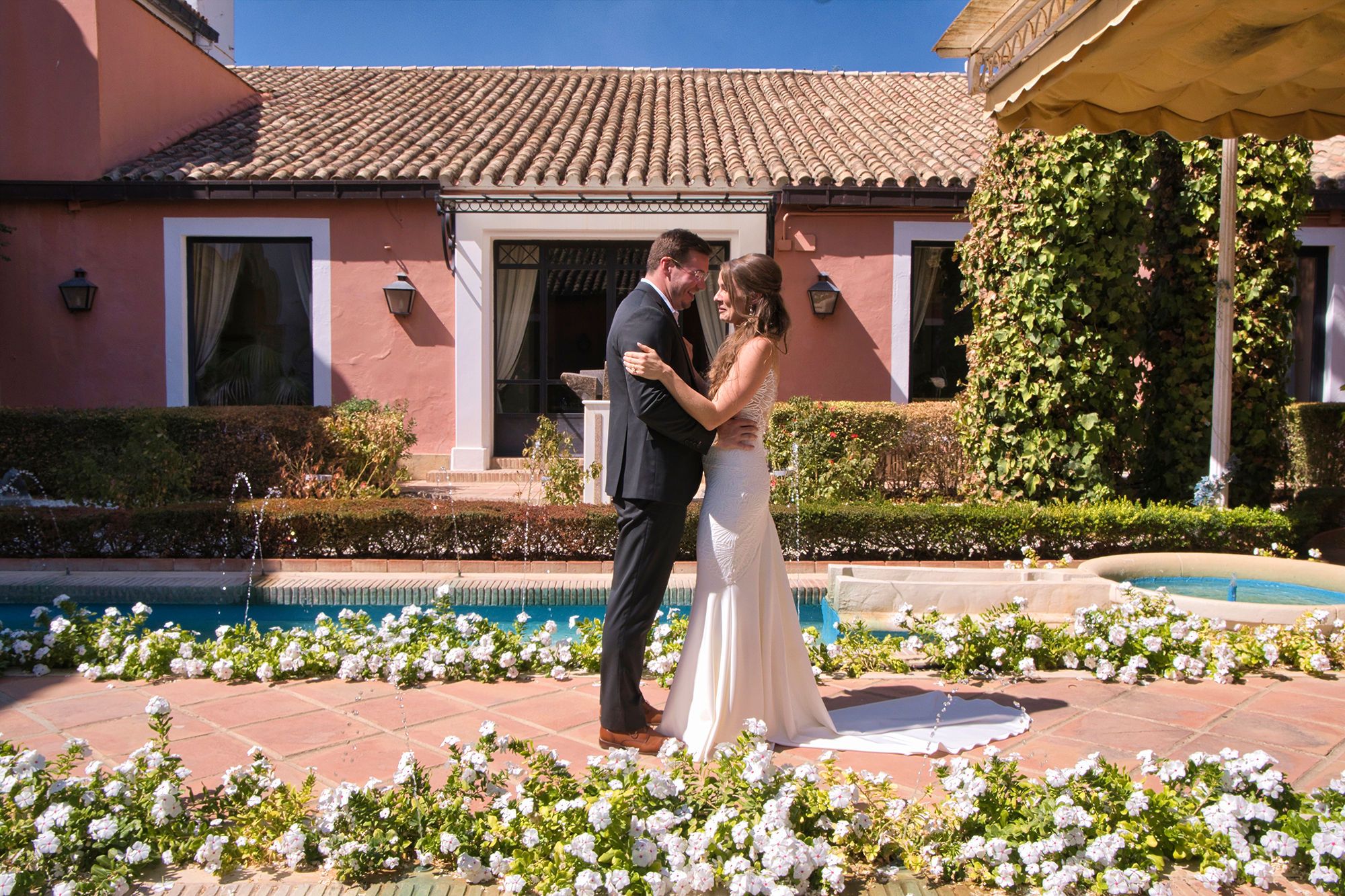 Bride and groom having their first look in the rustic farmhouse where they had an elopement in Spain