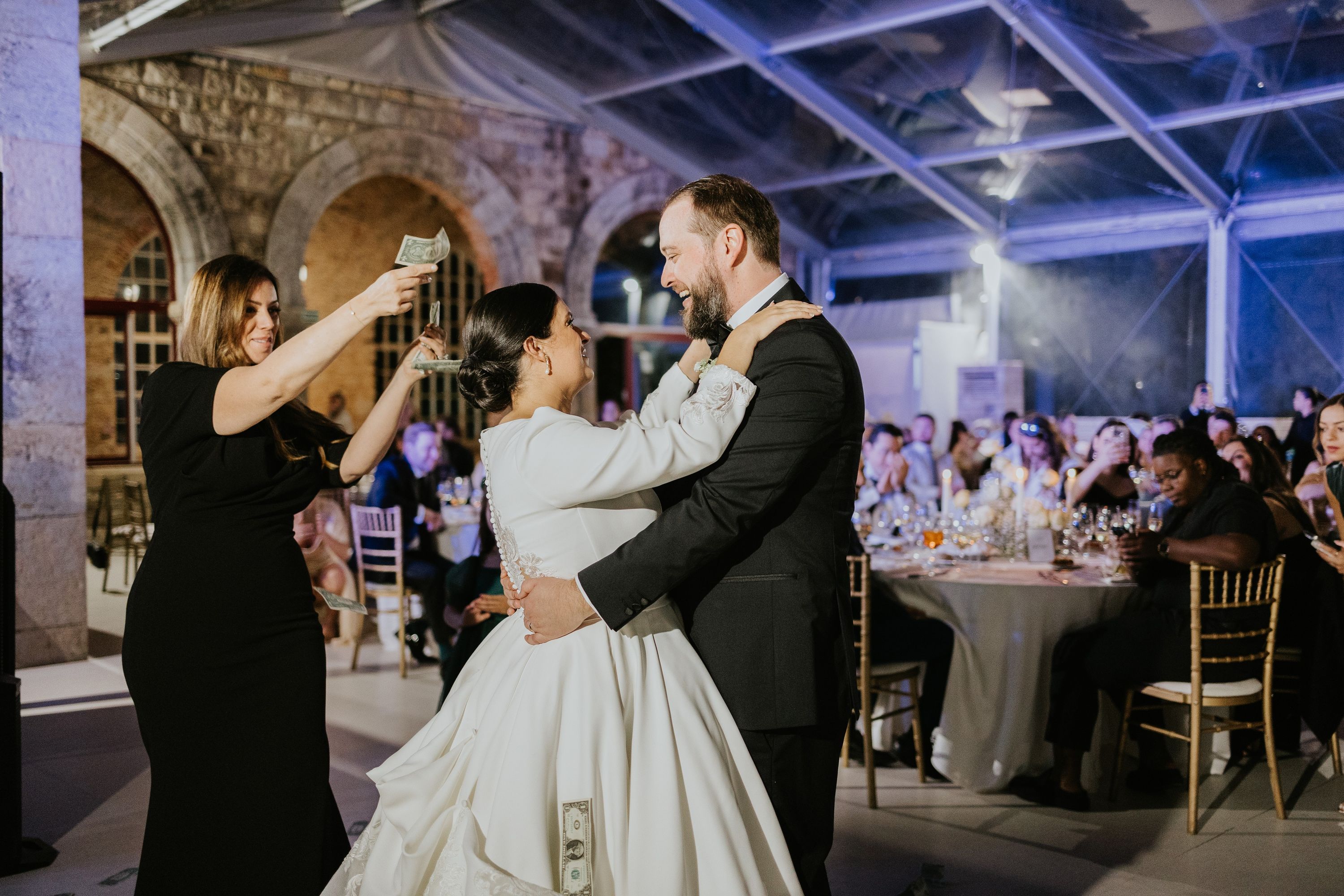 Bride and groom dance during the reception of their vow renewal in portugal