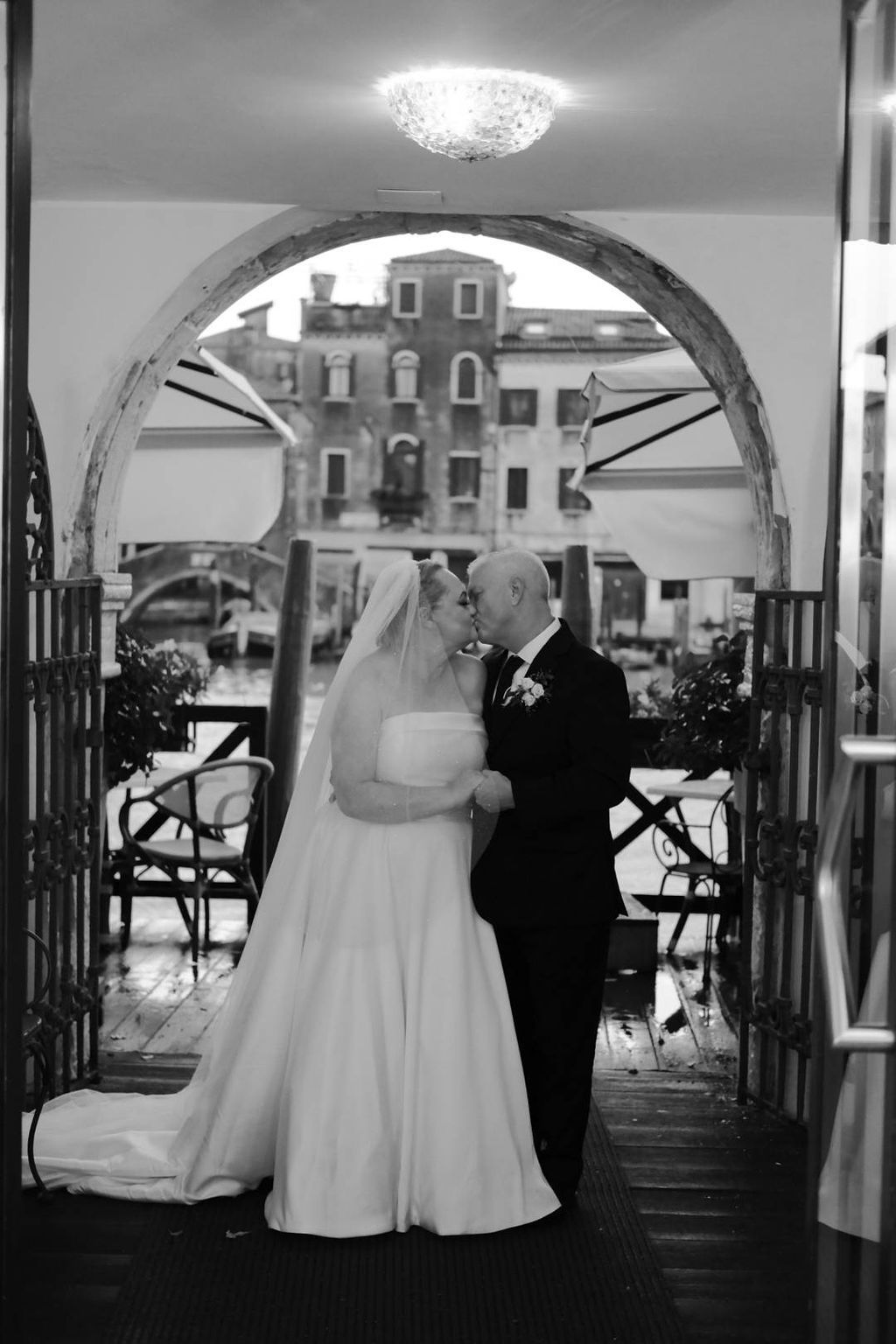 Bride and groom look at each other while having a romantic photoshoot after their vow renewal in Italy