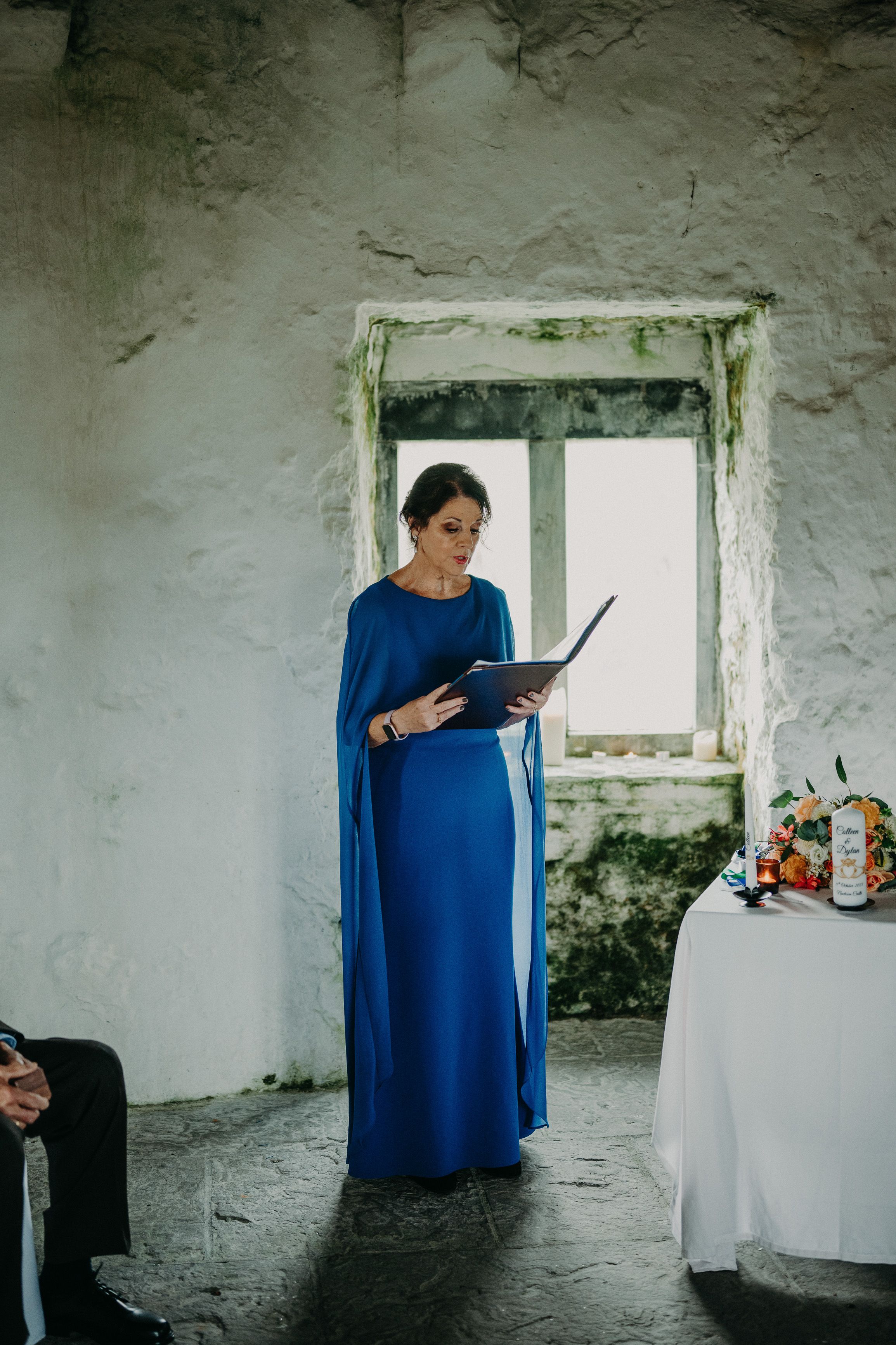 Mother of the bride gives a reading during an intimate wedding in Ireland ceremony.
