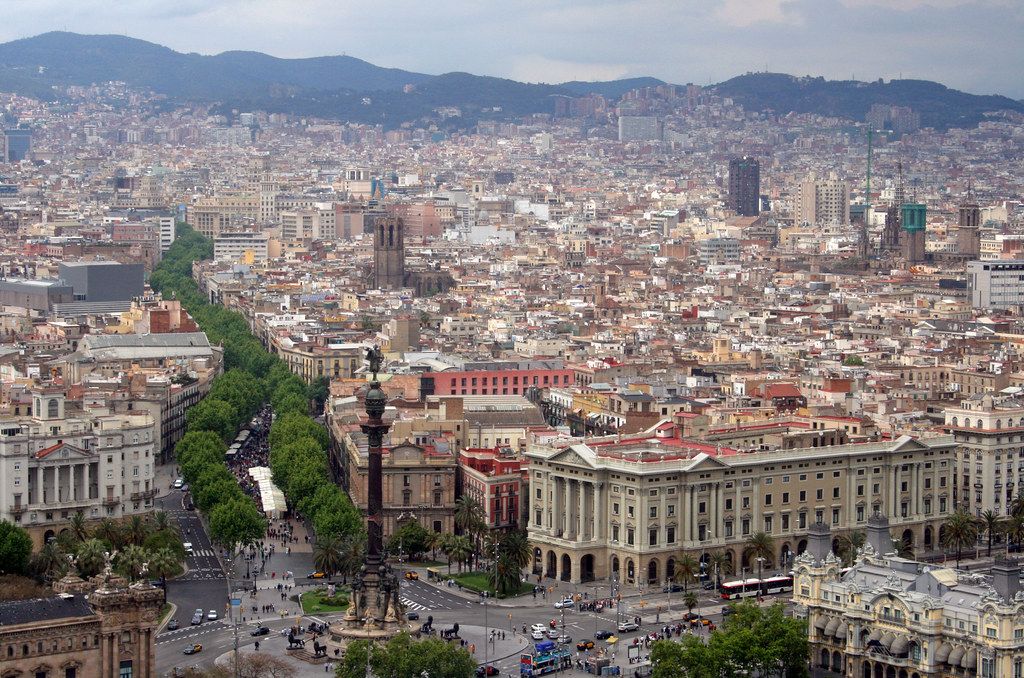Barcelona cityscape filled with many buildings under a bright day