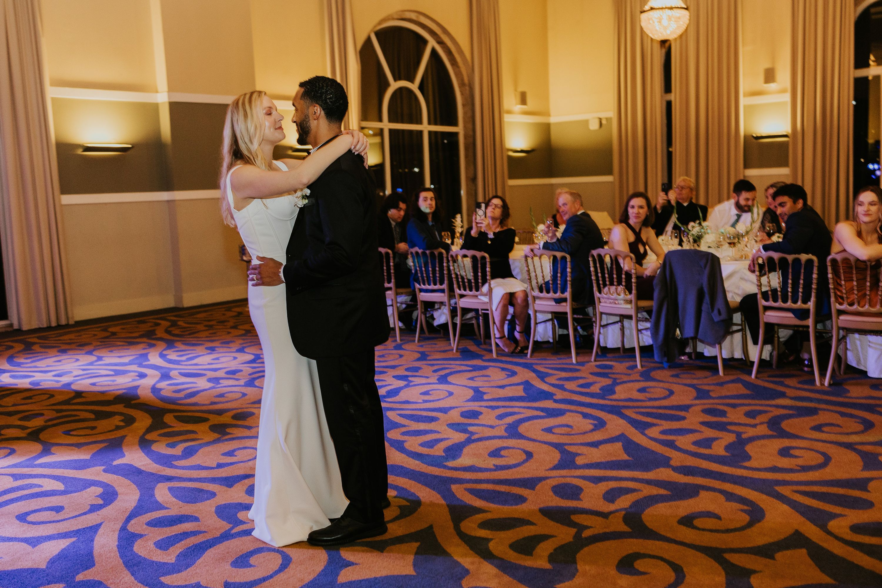 Bride and groom sharing their first dance at a reception during an intimate wedding in Portugal
