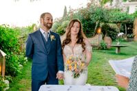 Bride and groom smiling during their Italian elopement ceremony in a terraced garden of a hotel on the Amalfi Coast