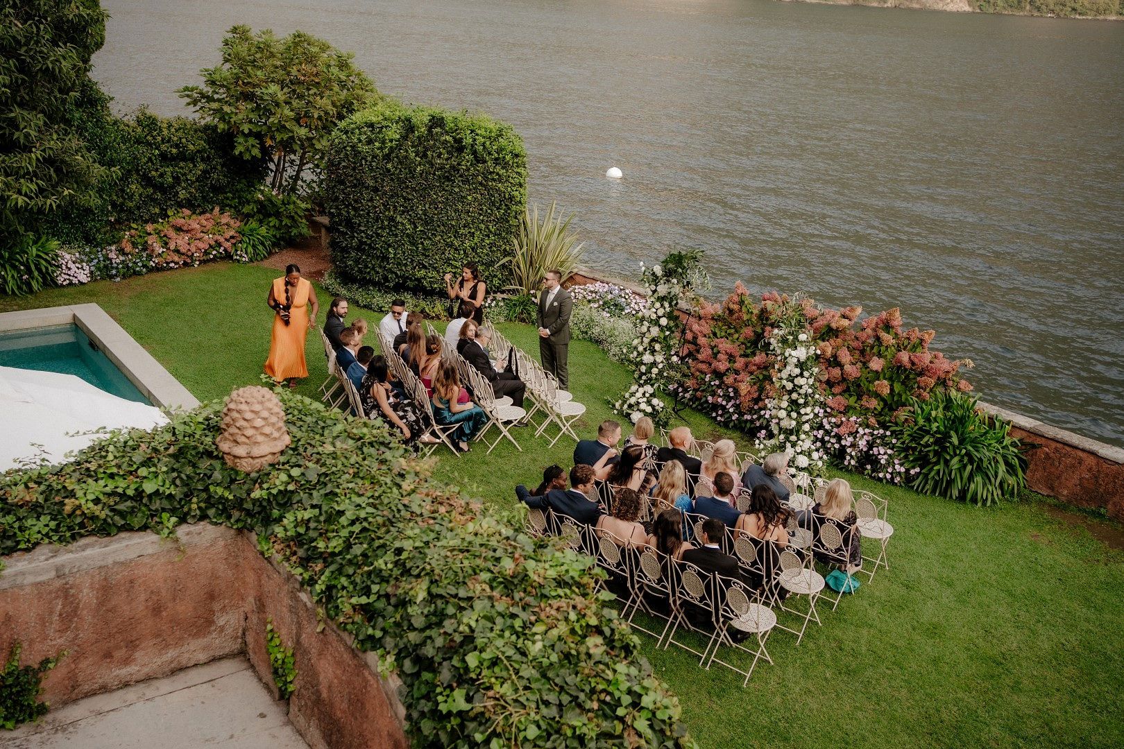 An outdoor ceremony of an Italian destination abroad at the garden of a villa along Lake Como