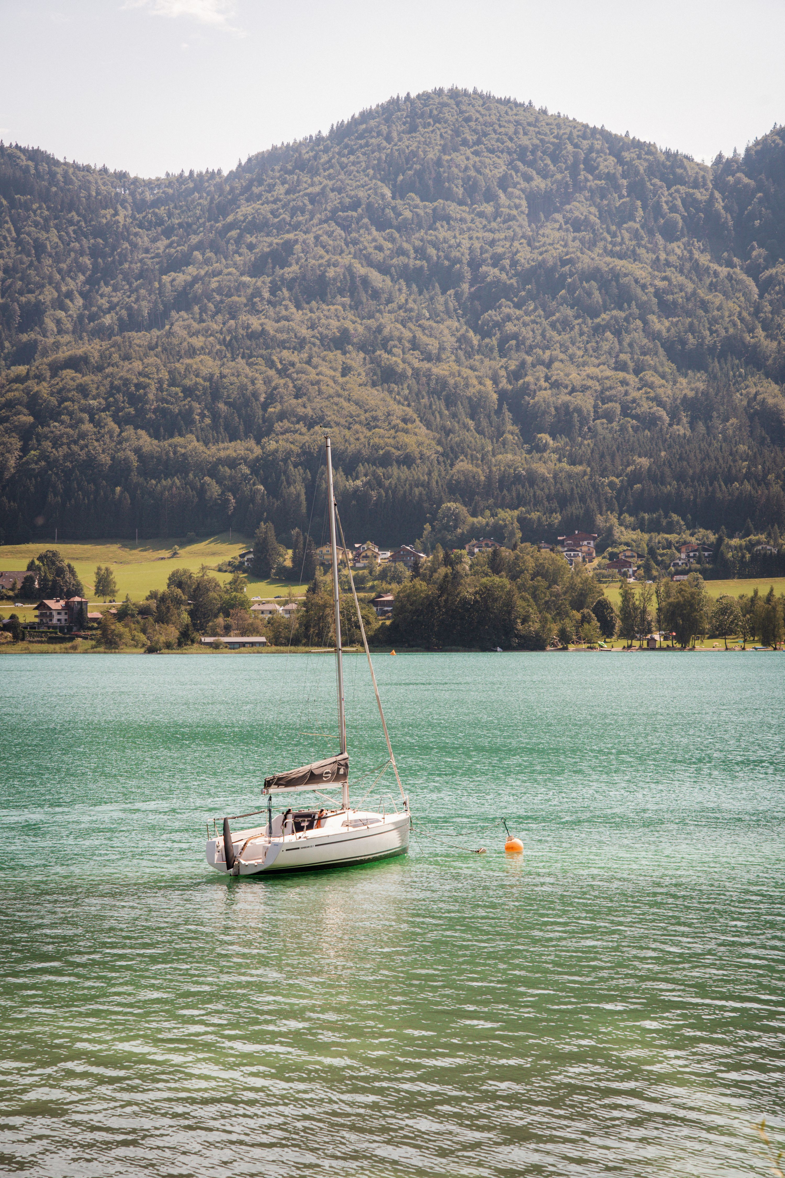 Sailboat moored on a turquoise Alpine lake in Austria