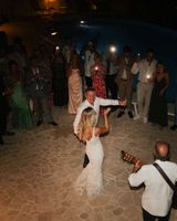 Bride dances with her Dad at night during the party of her small wedding in Italy