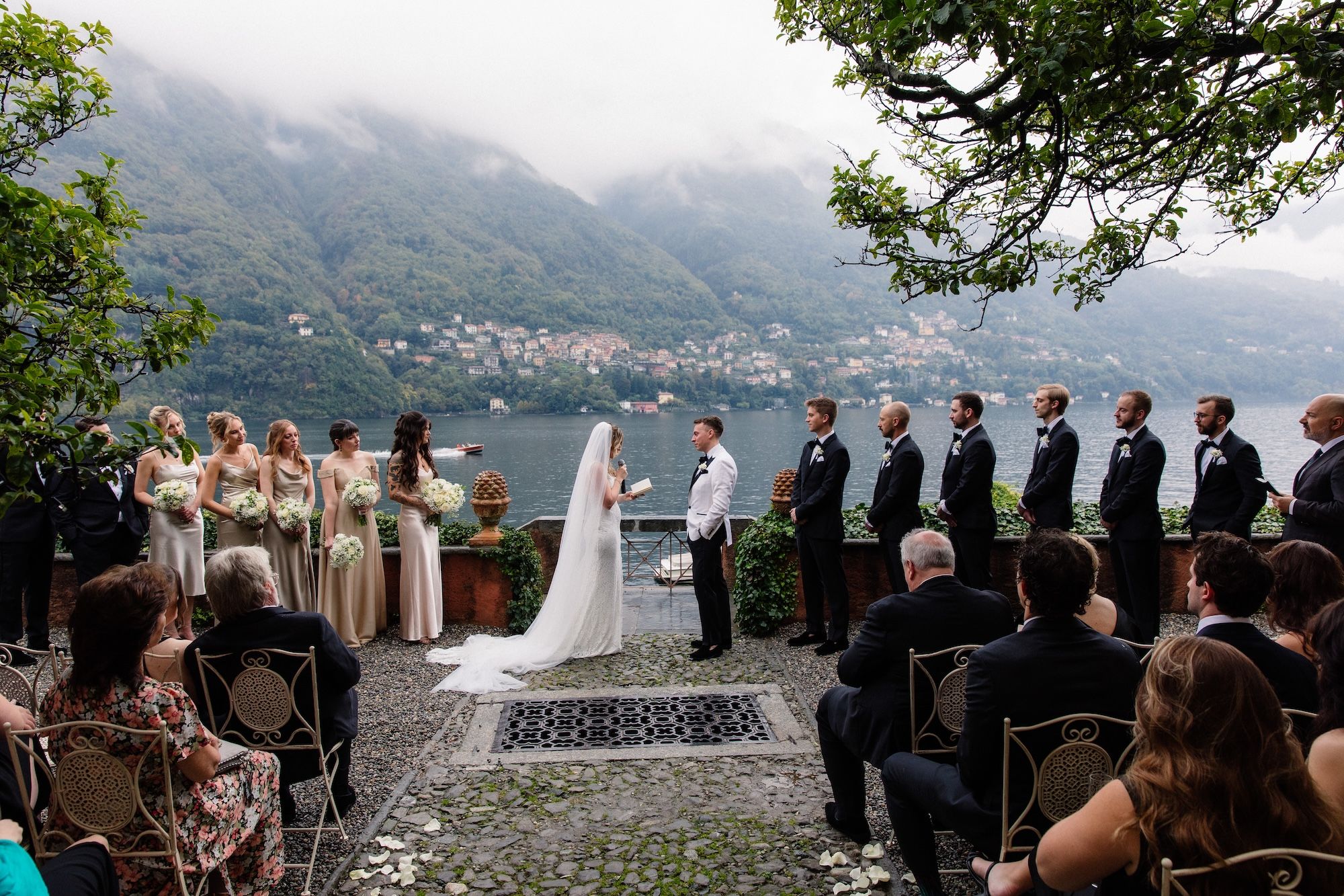 Bride and groom having a ceremony with Lake Como in the background as they renew vows in Italy