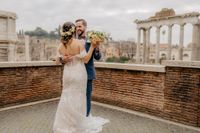 Bride and groom dancing romantically on the terrace overlooking the Imperial Fora during their elopement in Rome