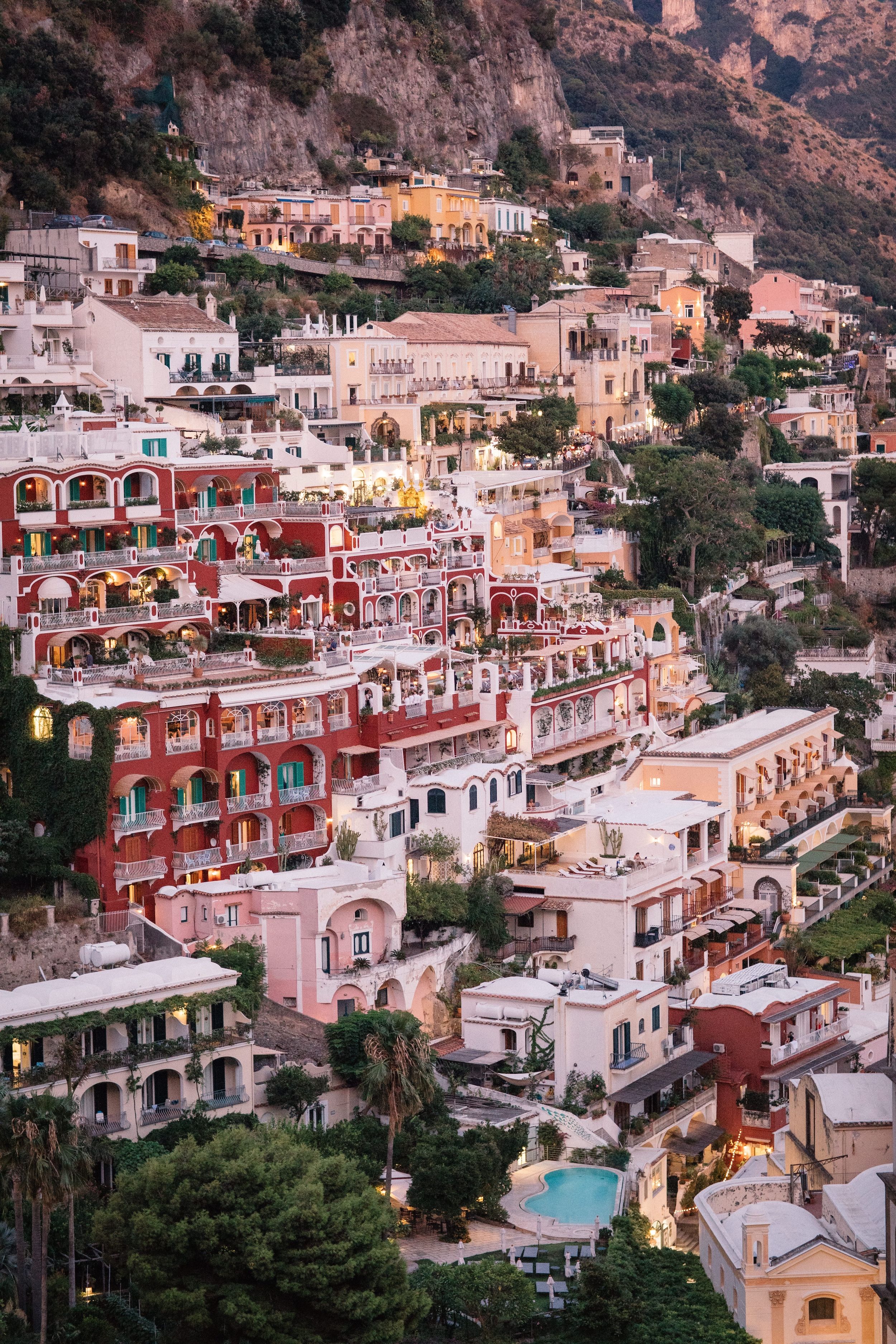 Pastel-colored hotels cascading down the coast in Amalfi, Italy