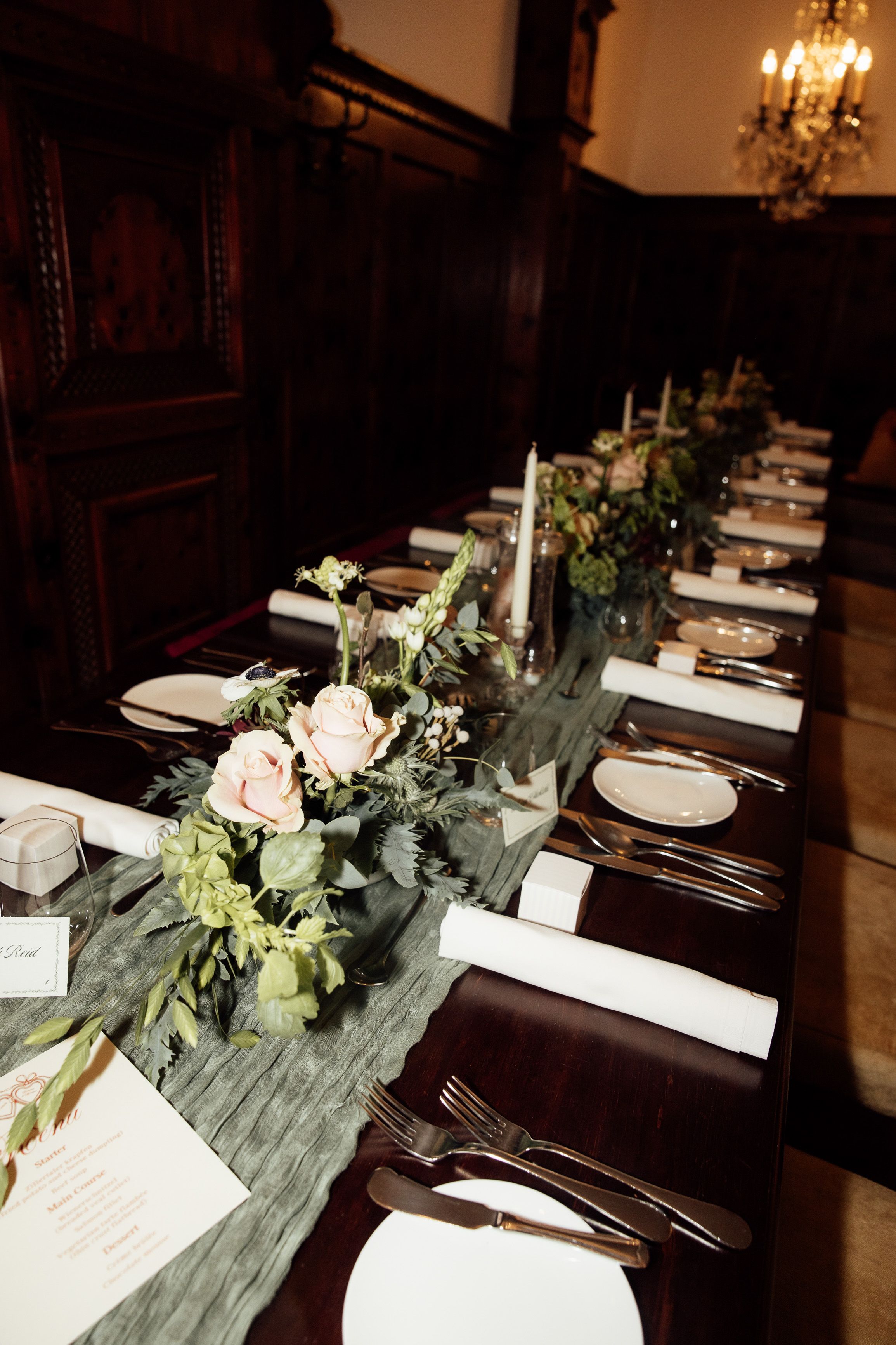 Elegant reception table with floral arrangements prepared for an intimate wedding in Austria