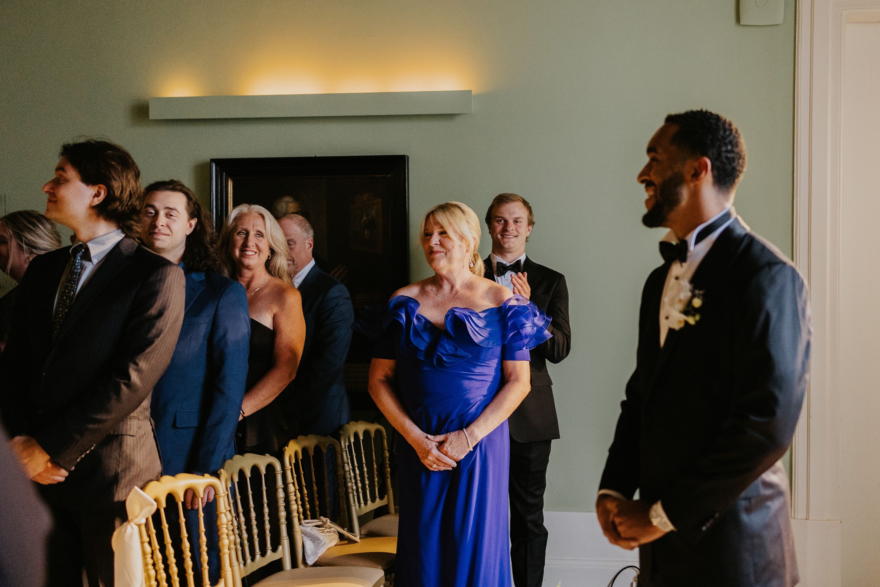 Guests in a destination wedding in Portugal waiting for the arrival of the bride during the ceremony