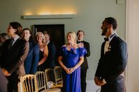 Guests in a destination wedding in Portugal waiting for the arrival of the bride during the ceremony