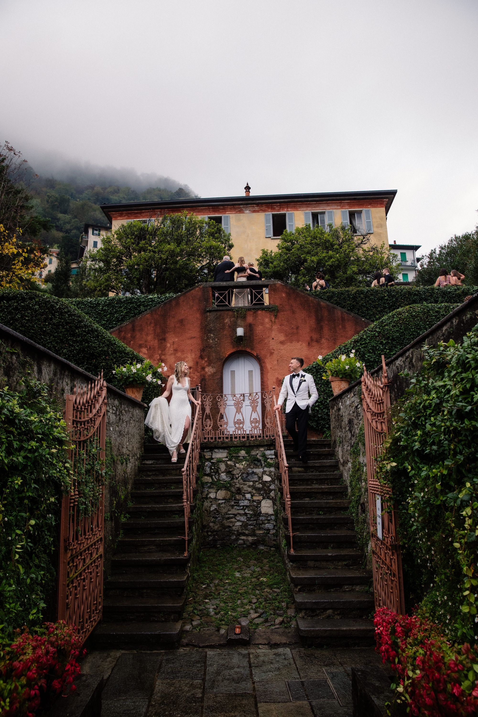 Newlyweds posing amidst the royal villa that served as their venue as they renew vows in Italy
