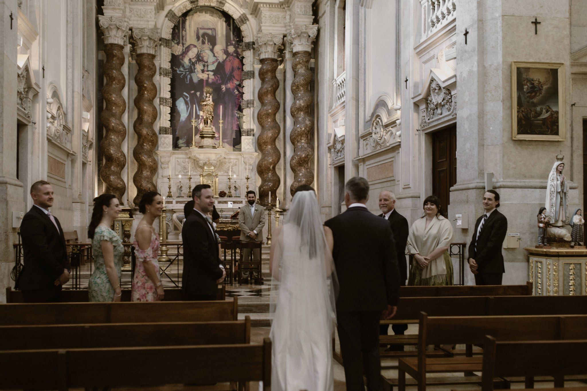 Bride and groom walking down the aisle in a church in Portugal