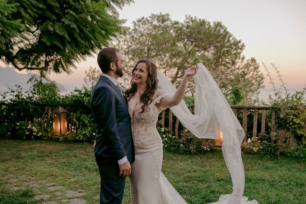 Newlyweds looking at each other after the ceremony of their elopement in Italy at a terraced garden in Amalfi