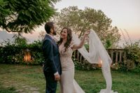 Newlyweds looking at each other after the ceremony of their elopement in Italy at a terraced garden in Amalfi