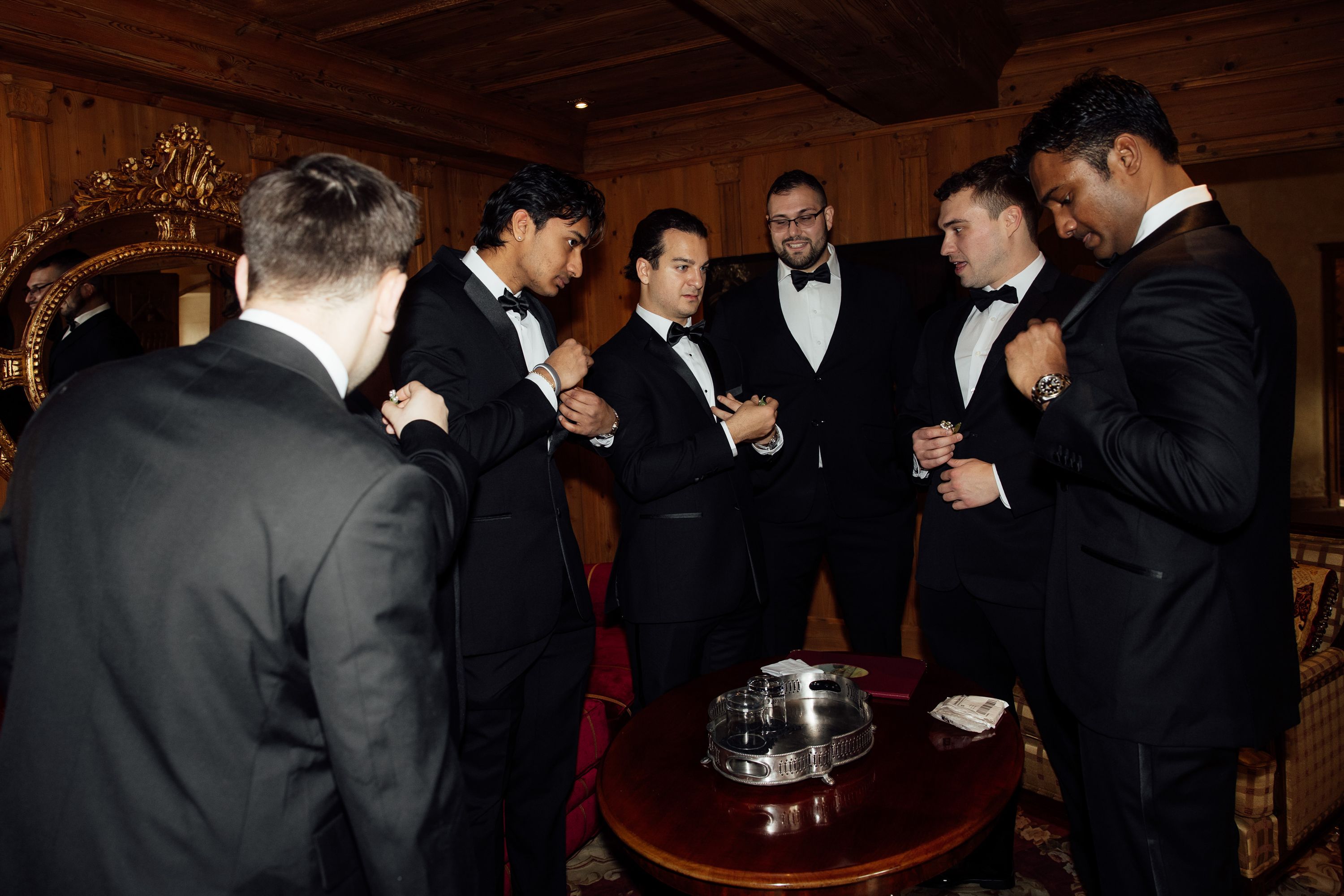 Groomsmen gather together while preparing for a small wedding in Austria