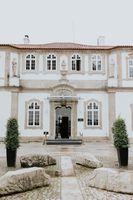 Facade of a white palace hotel in Porto where our couple had a micro wedding in Portugal