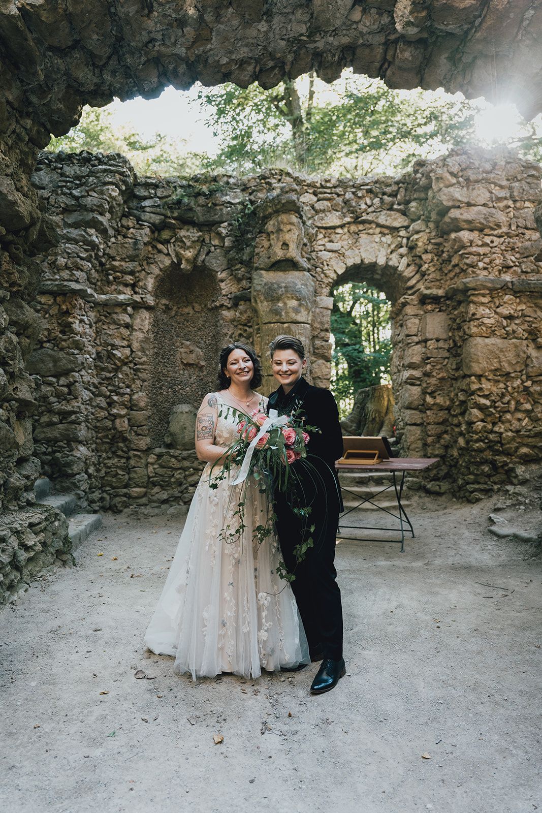 A bride and groom together in Sanspareil Rock Garden in Germany for their small wedding
