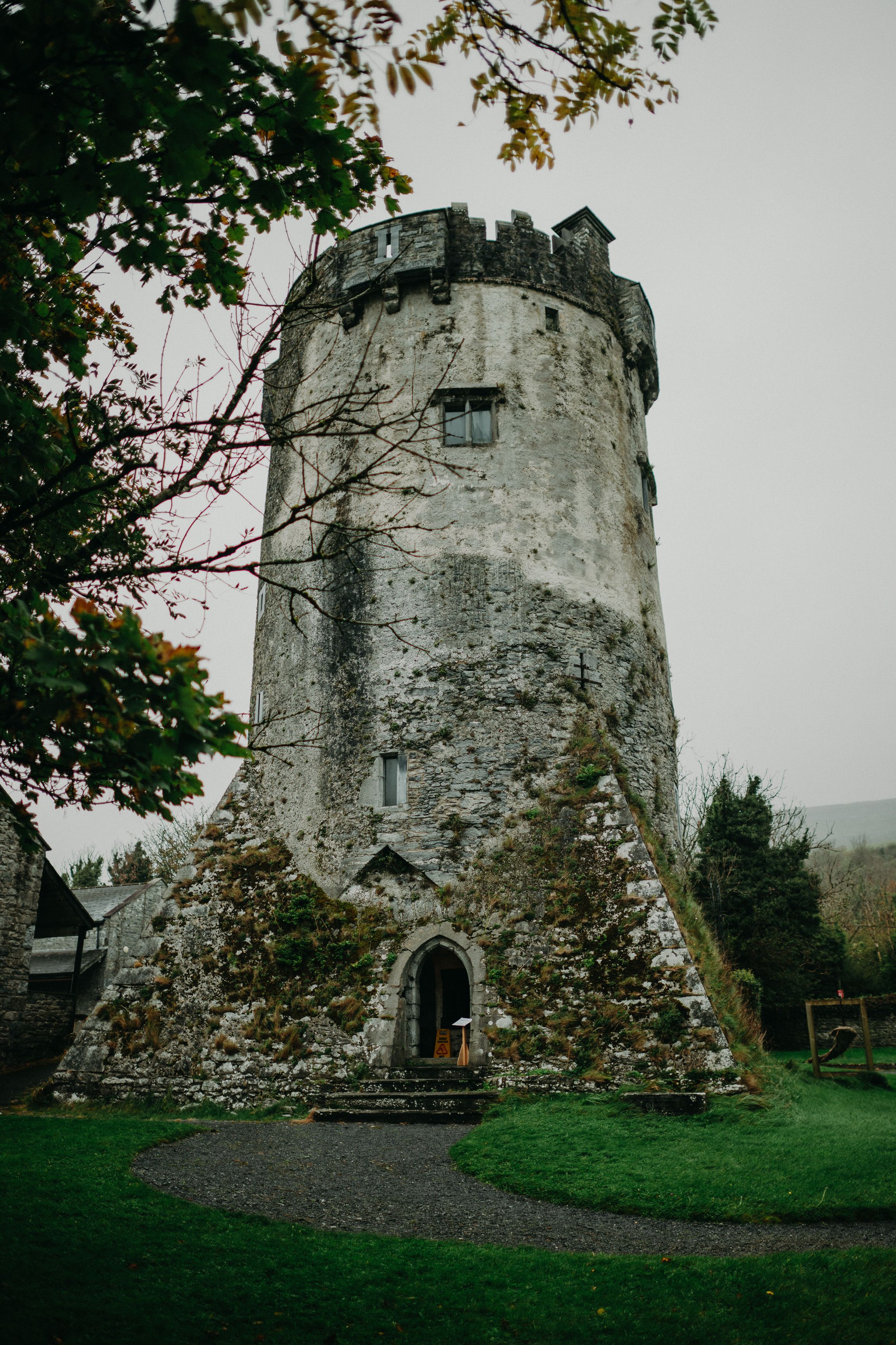 Historic Irish tower surrounded by greenery, a romantic venue for a small wedding in Ireland