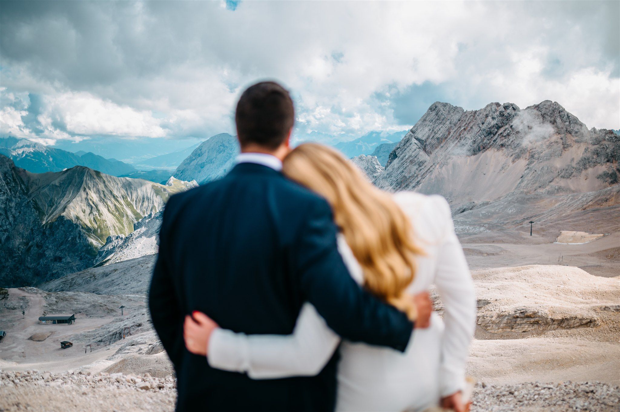 Bride and groom admiring the mountans at their desination wedding in Switzerland