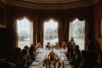 An indoor reception in a mansion in Londonderry during an Irish wedding abroad