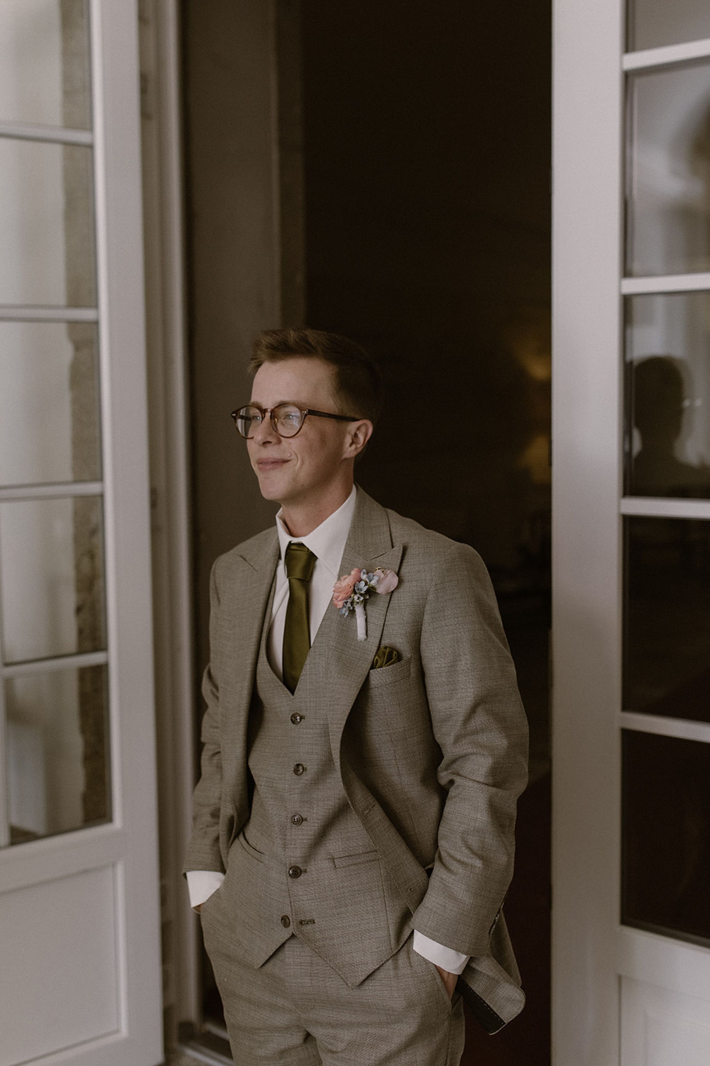 Groom waiting for the first look in a historic manor during a small wedding in Portugal