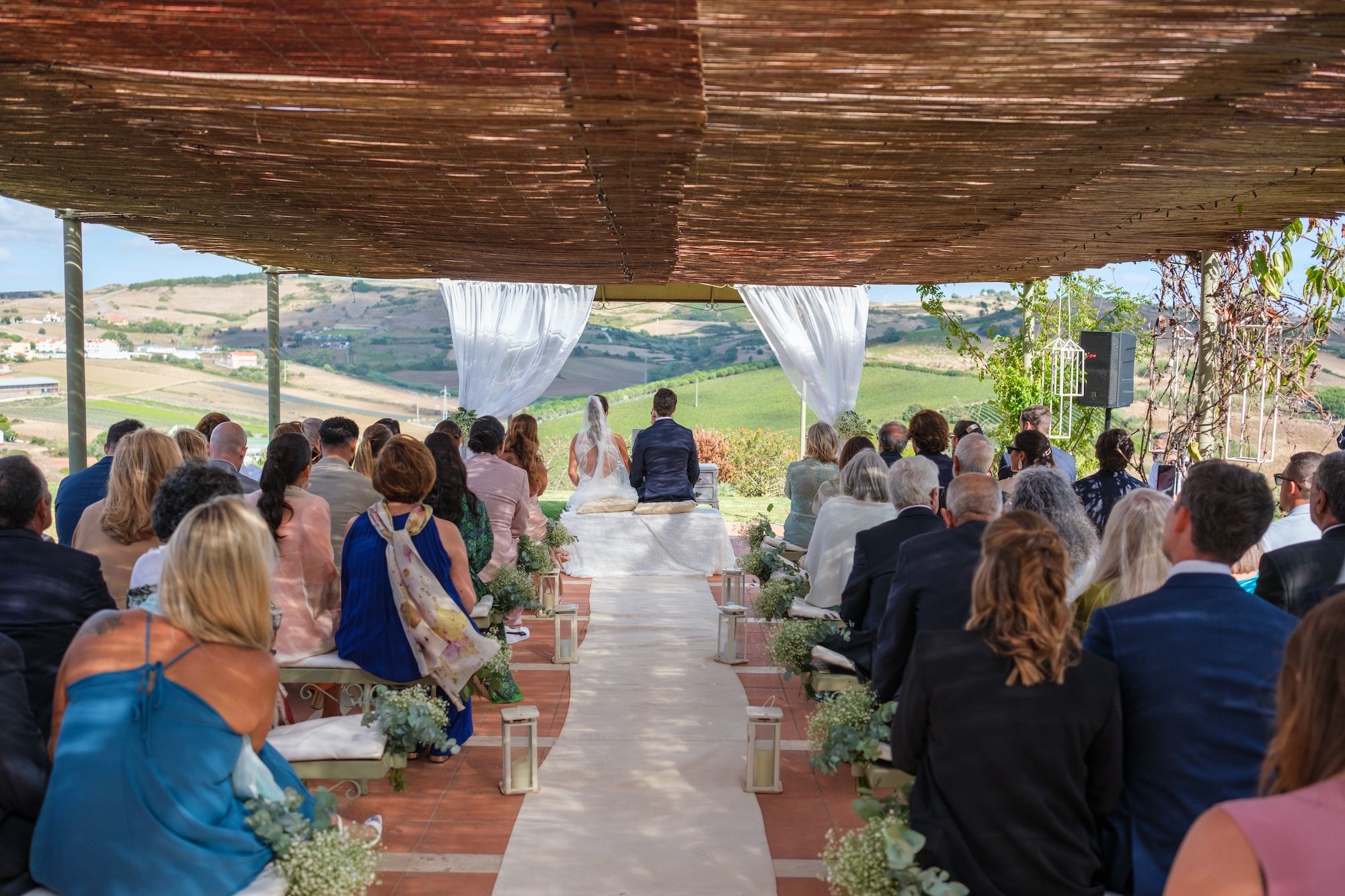 Wedding ceremony in an open barn of a quinta for destination weddings in Portugal